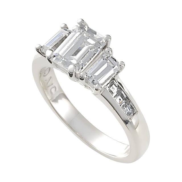 Three Stone Emerald Cut Diamond Ring With Channel Set Diamonds On The Side